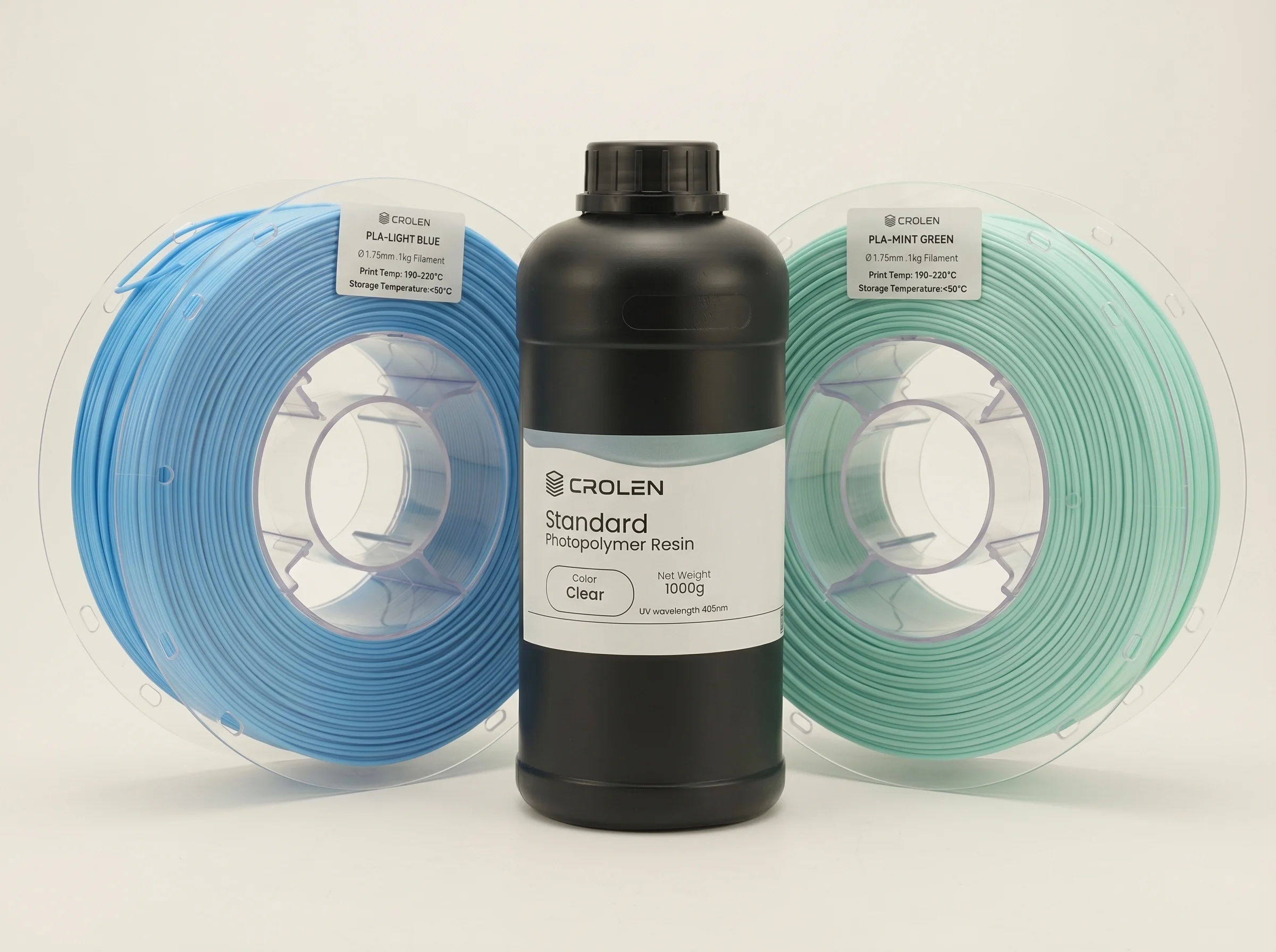 Crolen light blue and mint green filament spools with a Crolen resin bottle