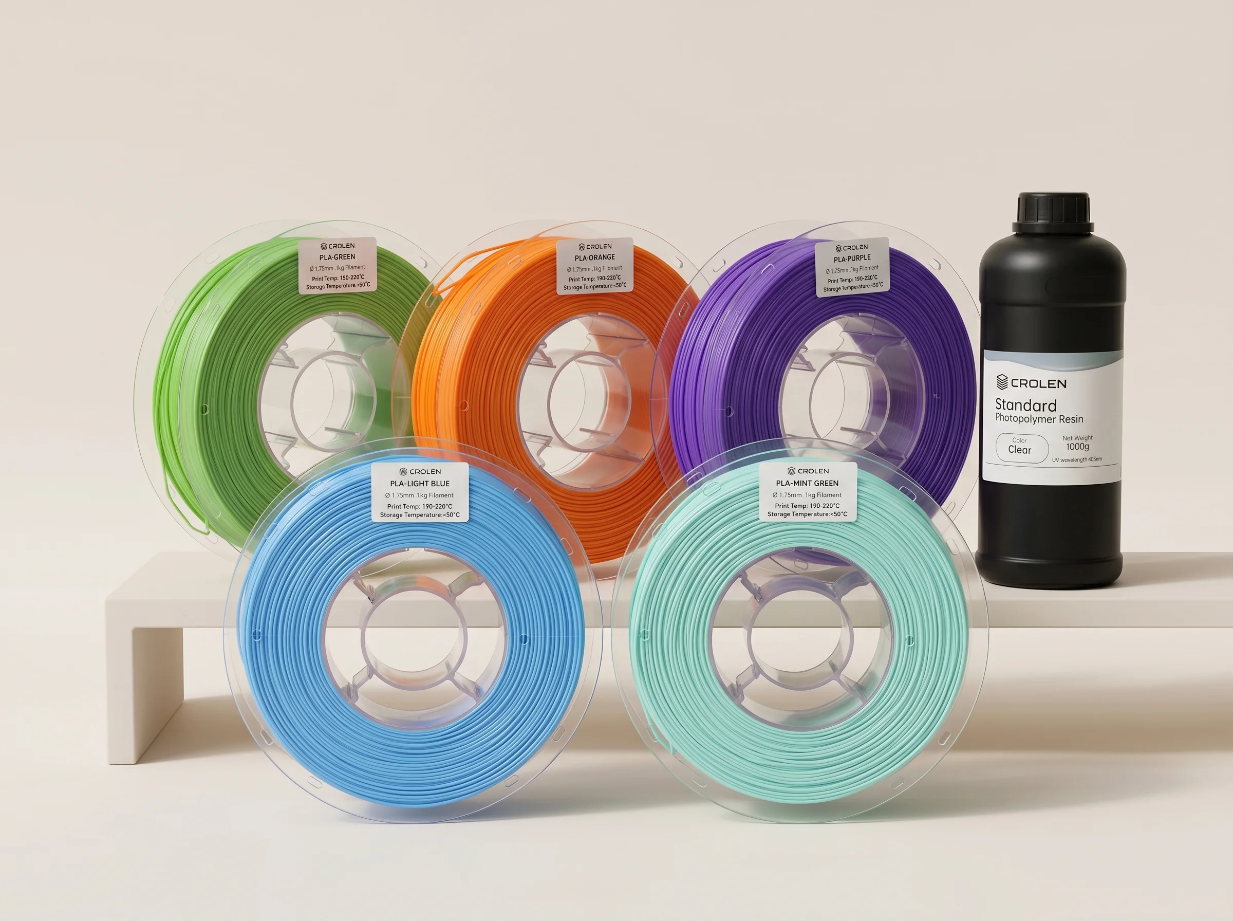 Crolen filament spools and resin bottle arranged together